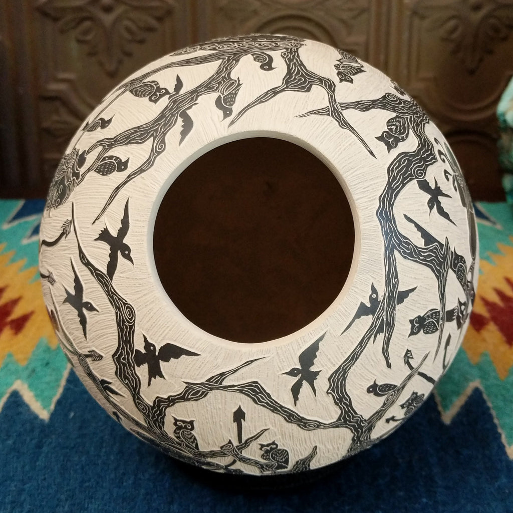 Hollow and textured lip of the pottery piece.