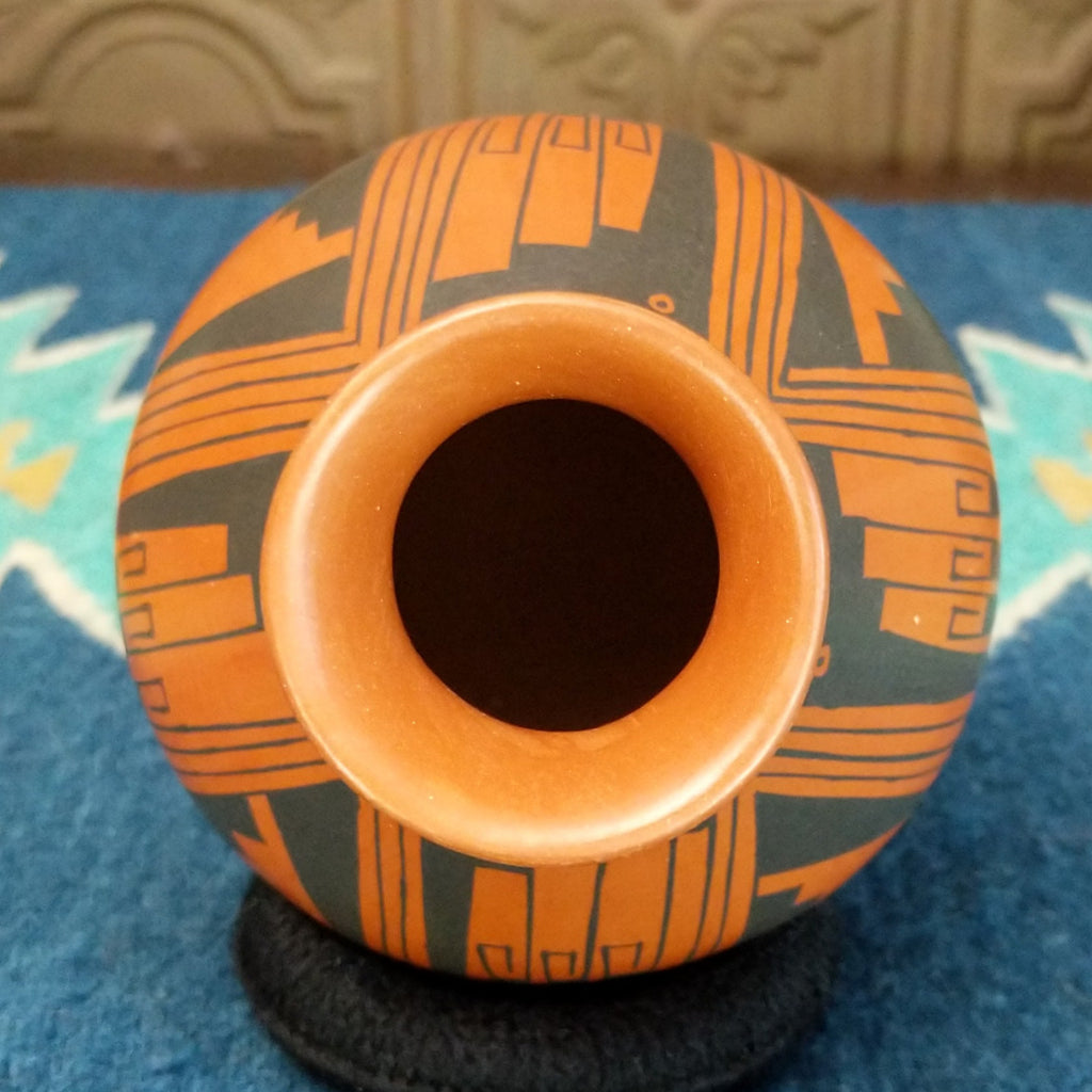 The top features the flared lip of the piece.