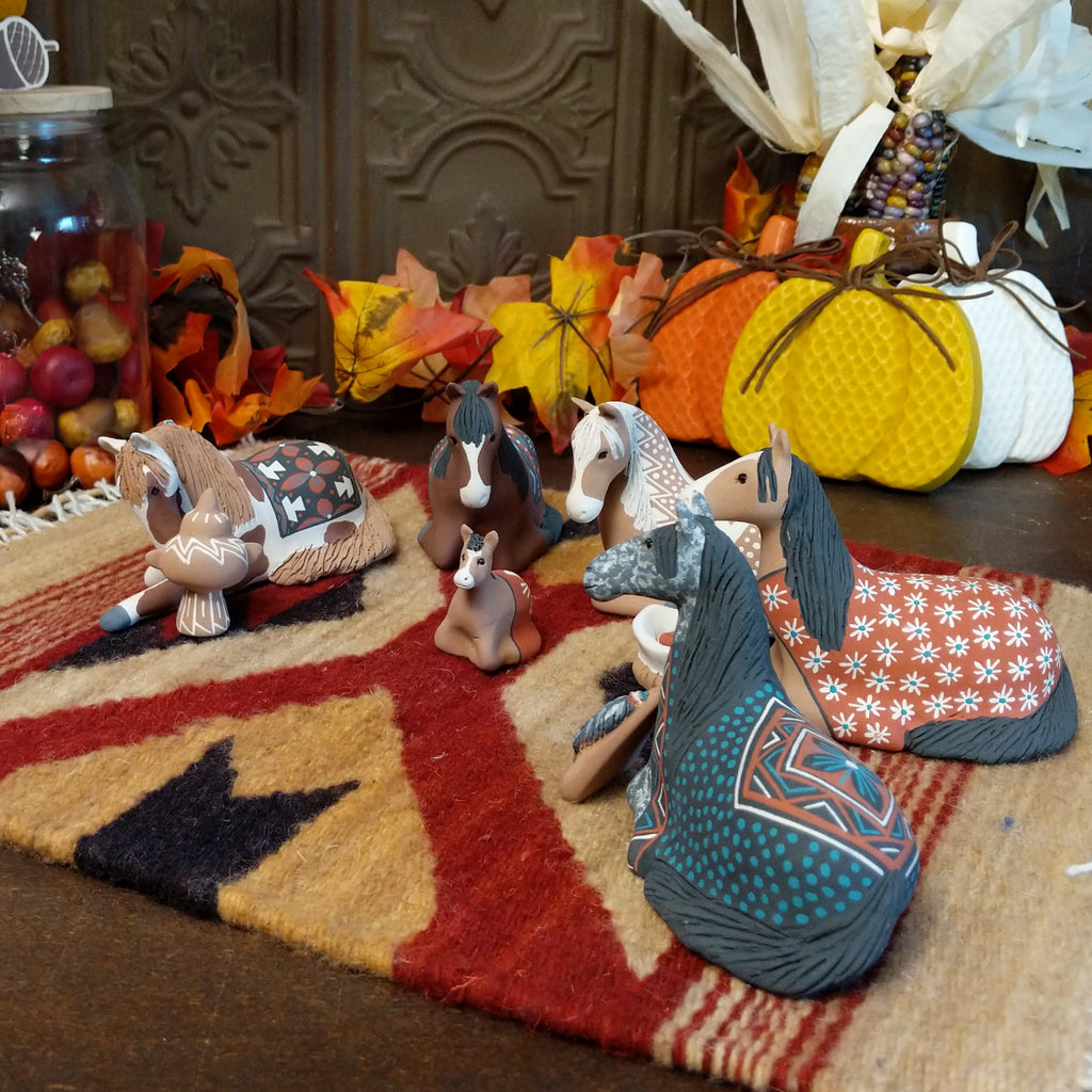 Clay made into horses depicting a traditional nativity scene.