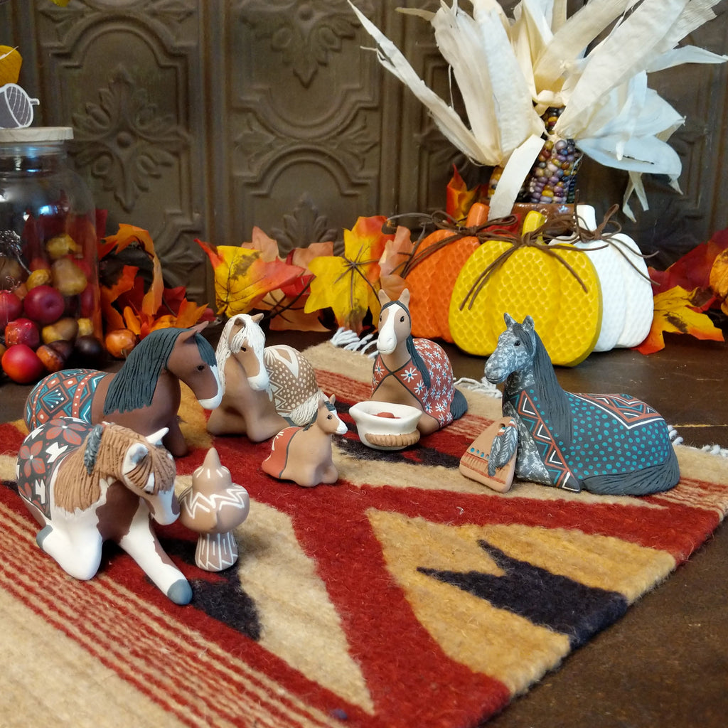 Clay made into horses depicting a traditional nativity scene.