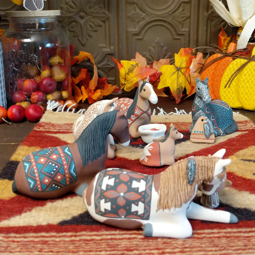 Clay made into horses depicting a traditional nativity scene.