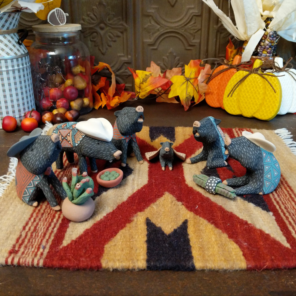 Clay used to create javelinas wearing ponchos and cowboy hats in vibrant colors.