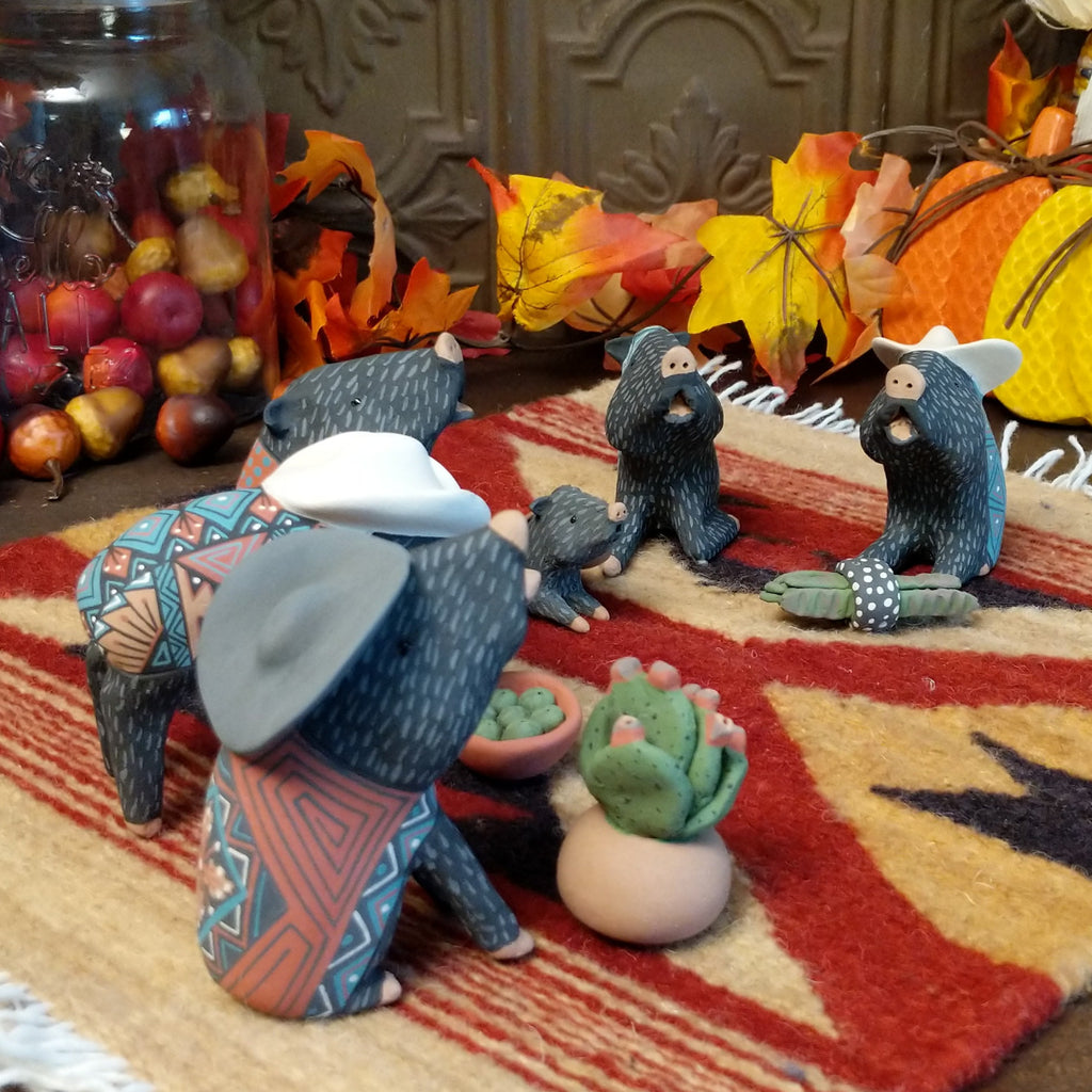 Clay used to create javelinas wearing ponchos and cowboy hats in vibrant colors.