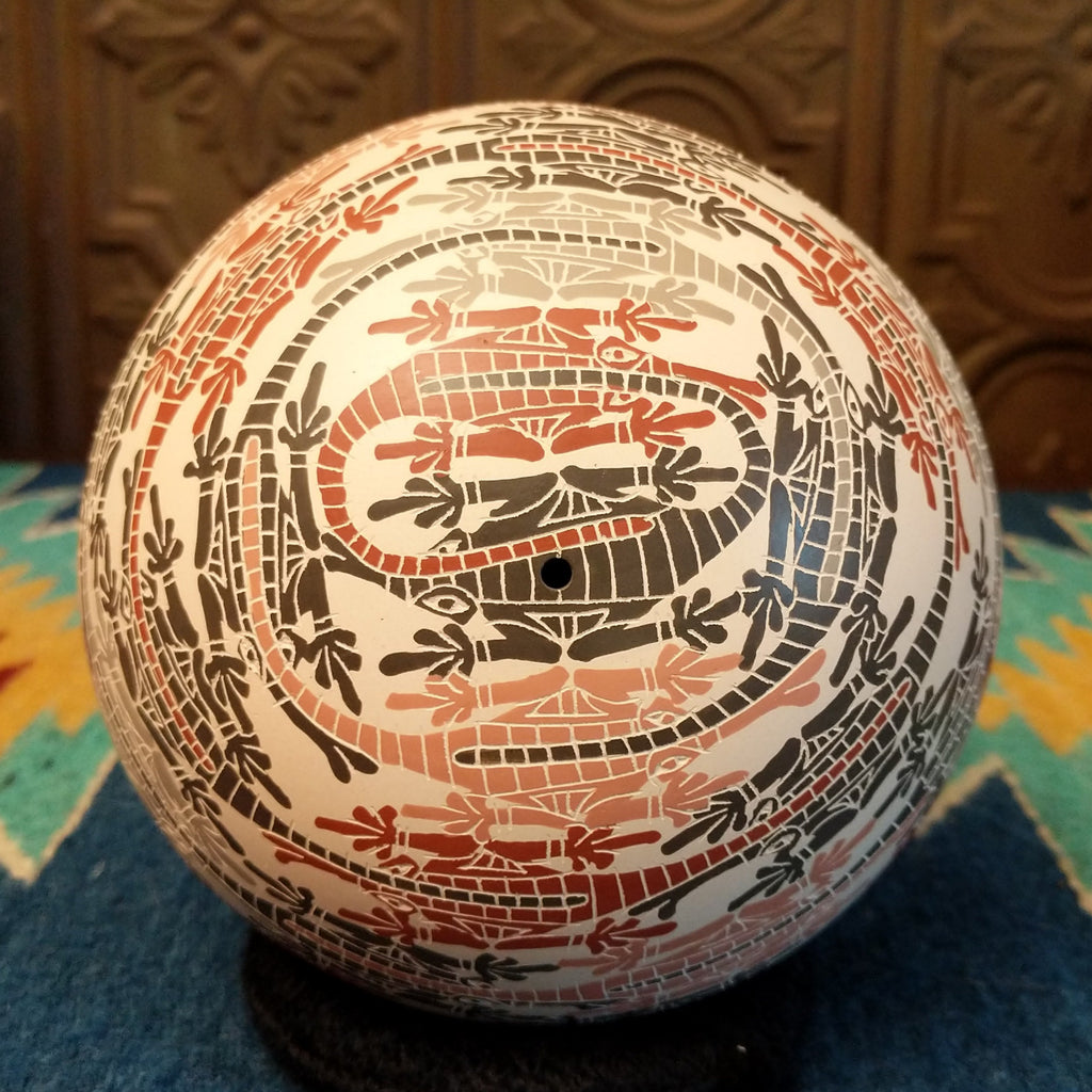 Top of the seed pot with small opening.