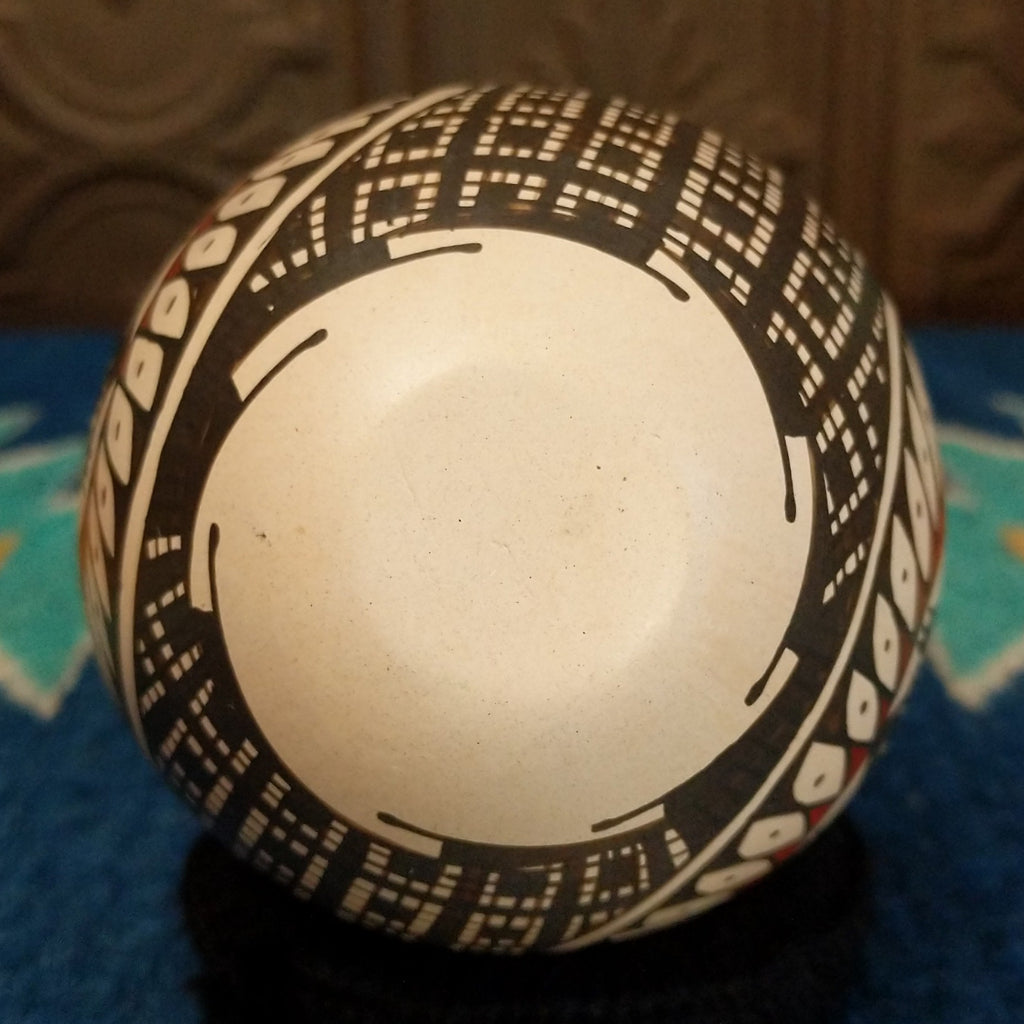 The underside of the piece is signed.