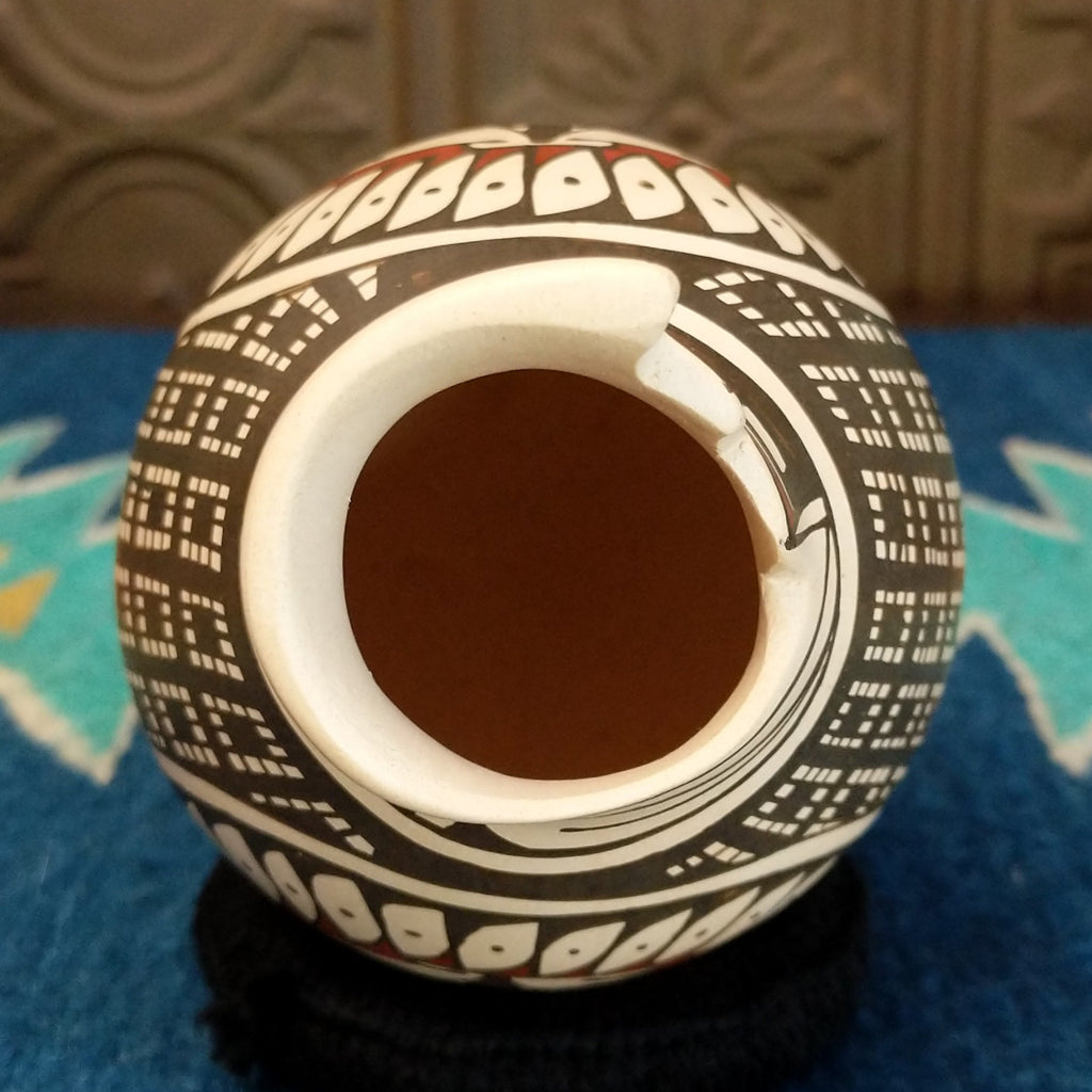 The top of the piece features a stepped lip.
