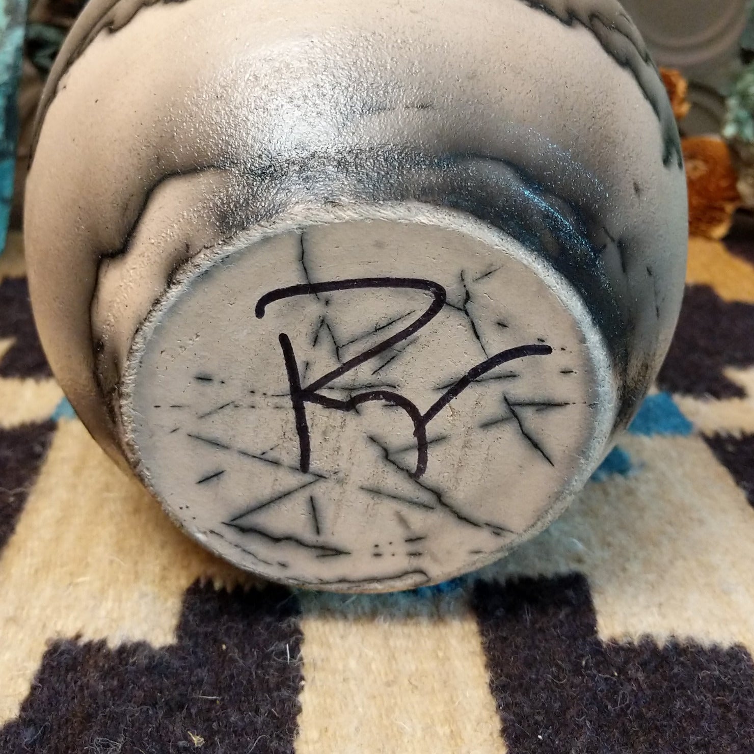 Close-up of the artisan's signature.