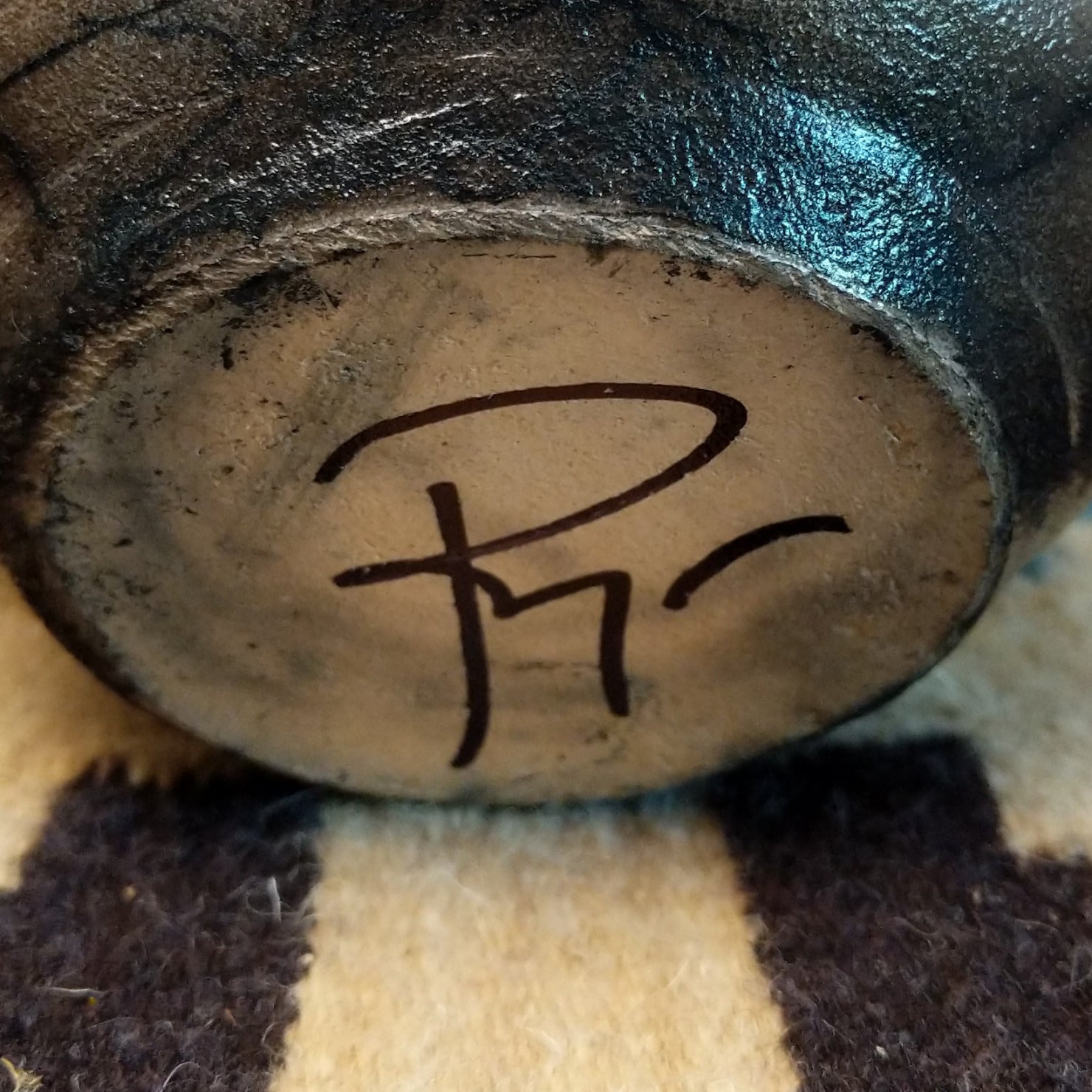 Close-up of the artisan's signature.