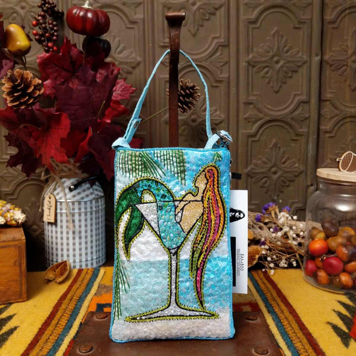 Sparkling Martini Club Bag by Bamboo Trading featuring a colorful beaded martini glass with an olive, shimmering aqua and white sequins, intricate embroidery, and a coordinating shoulder strap.