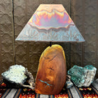Mesquite wood base showcases natural turquoise inlays, topped with a copper shade.