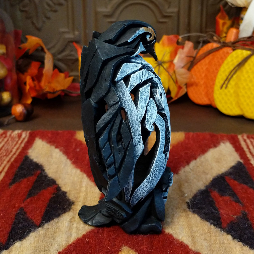 Cast marble used to create a penguin with a baby penguin at the feet.