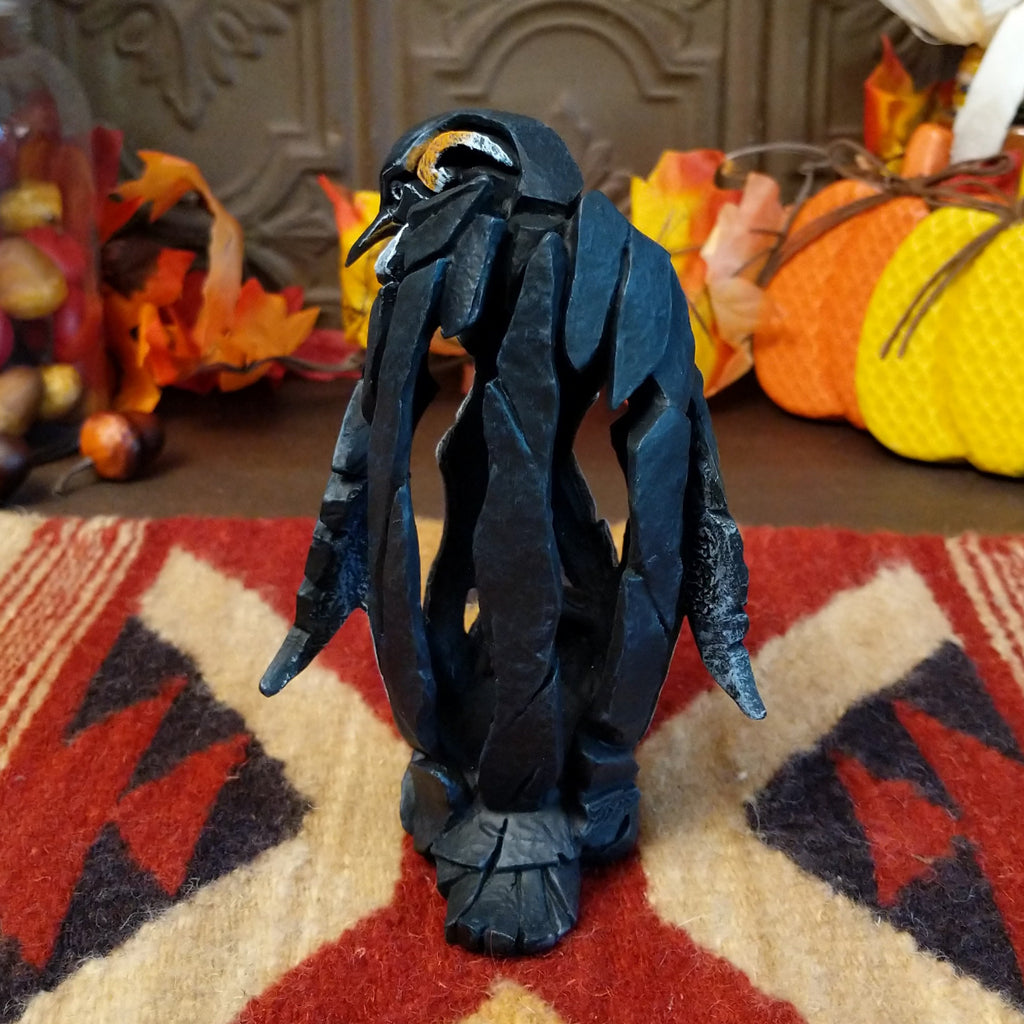 Cast marble used to create a penguin with a baby penguin at the feet.