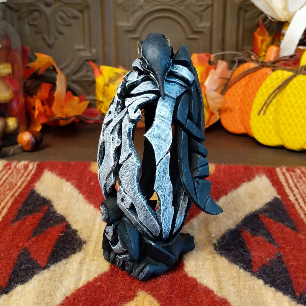 Cast marble used to create a penguin with a baby penguin at the feet.