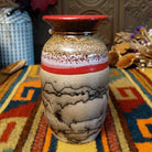Mini horsehair pottery vase by Roger Calhoun with a flared red rim, gold and lavender crackled shoulder, red accent band, and black horsehair markings on a cream-colored body.