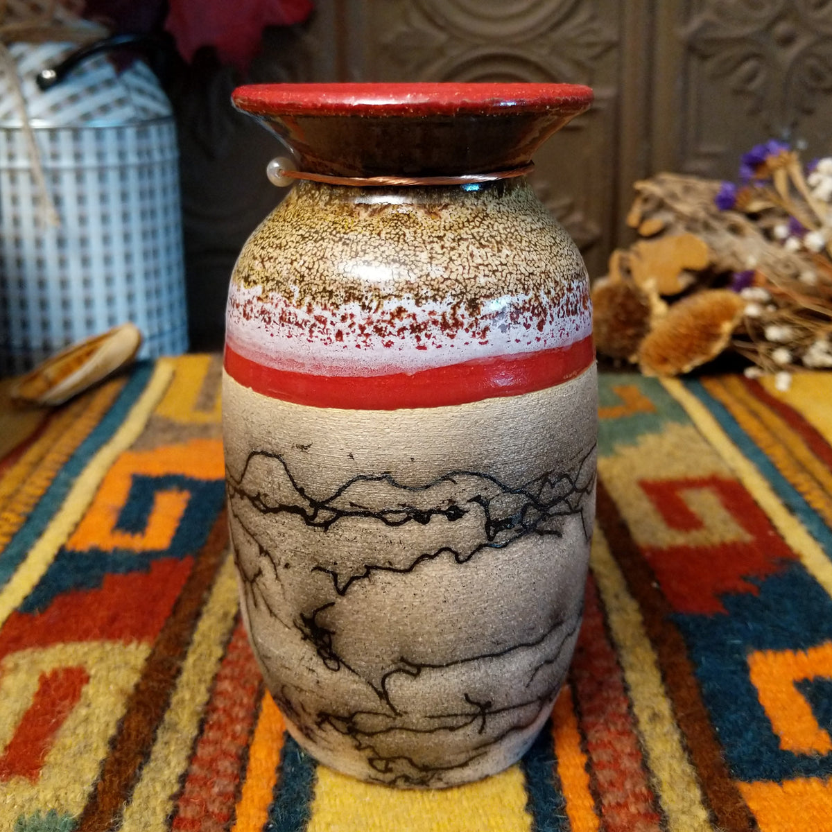 Mini horsehair pottery vase by Roger Calhoun with a flared red rim, gold and lavender crackled shoulder, red accent band, and black horsehair markings on a cream-colored body.