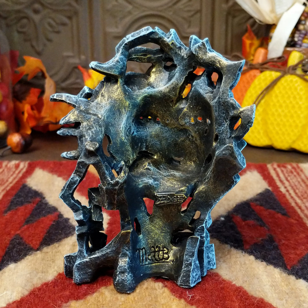 The back side of the piece is hollowed out from the molding.