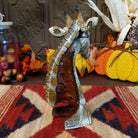 Cast marble used to create a miniature giraffe head painted in traditional colors representing the animal.