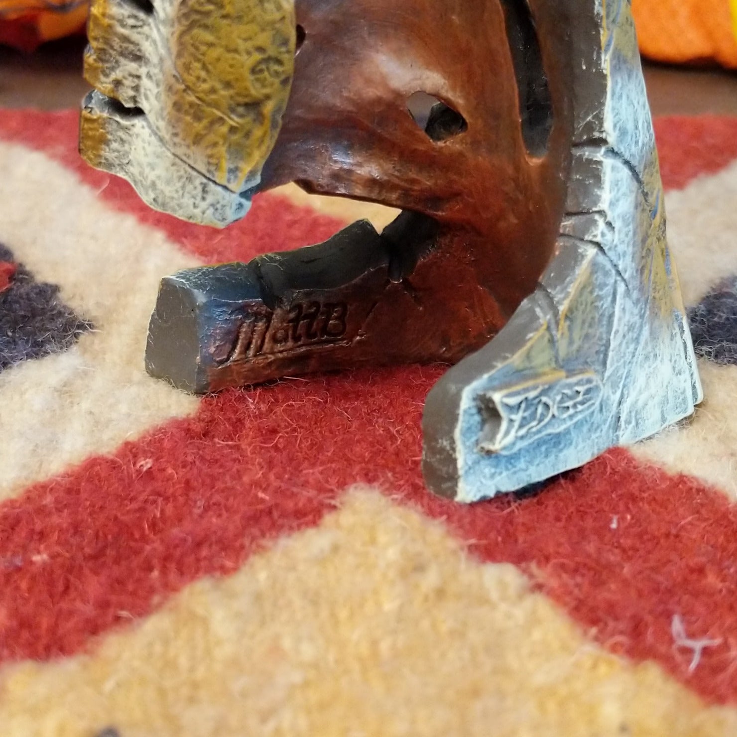 The artisan's signature is found on the interior of the cast mold.