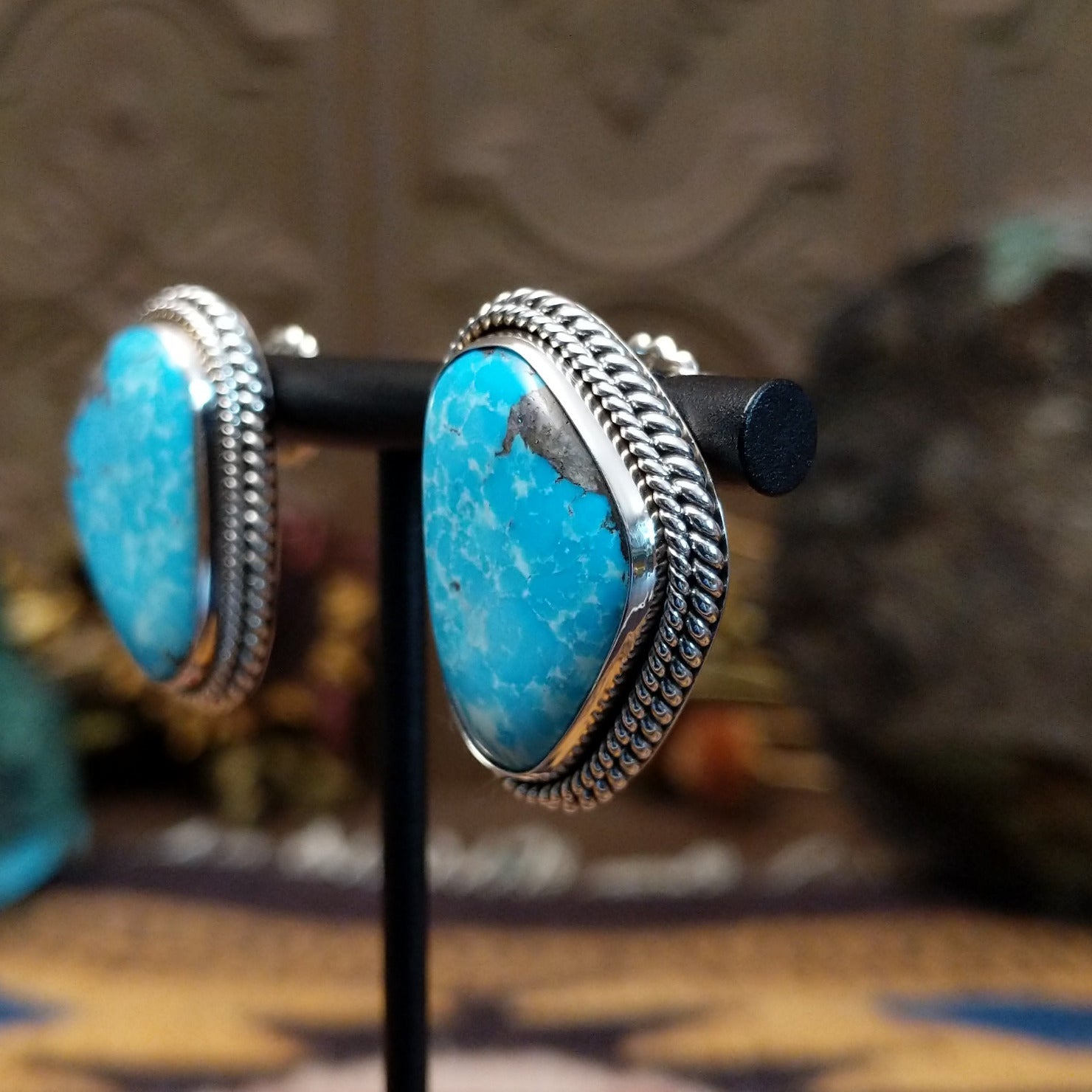 Sterling silver Morenci Turquoise stud earrings featuring freeform blue stones with natural matrix and twisted rope detailing.