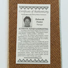 Close up of the Certificate of Authenticity and Artist information. 