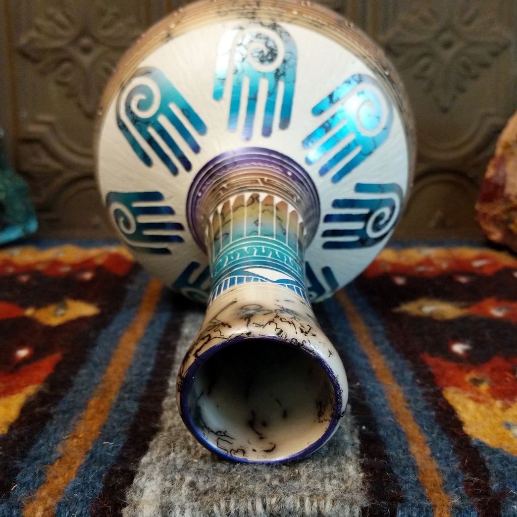 The inside of the vase is hollow with white clay and horsehair fired into the vase.