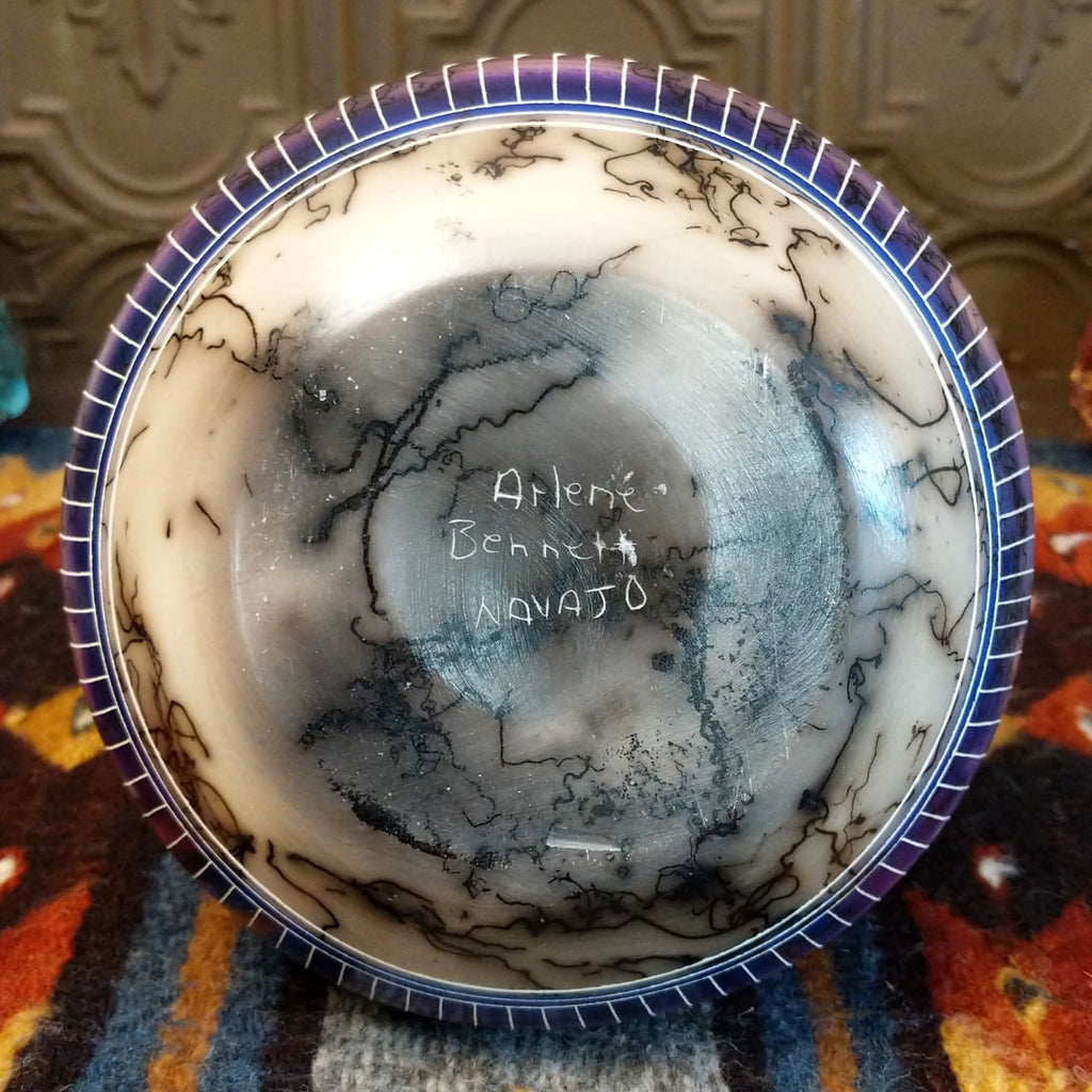 Arlene Bennet's signature is etched onto the bottom of the vase.