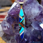 14kt gold Steve Francisco navette pendant with elongated geometric multistone inlay.