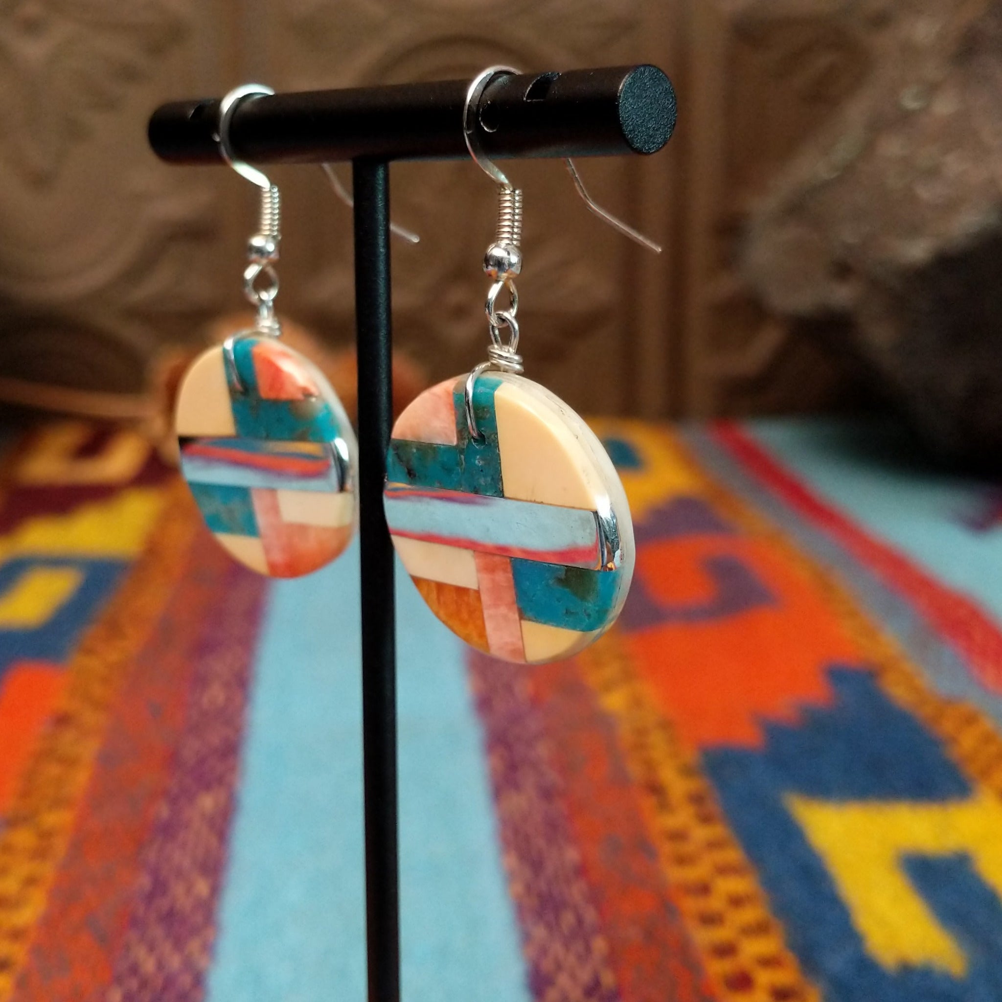 Multistone Circle Earrings by A. Medina with geometric stone and shell mosaic inlay.