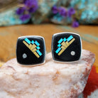Sterling silver Ambrose Tsosie cuff links with black inlay and geometric multistone design.