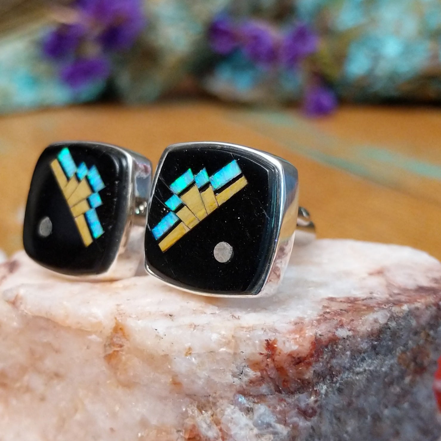 Sterling silver Ambrose Tsosie cuff links with black inlay and geometric multistone design.