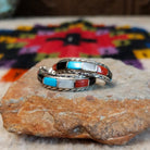 Multistone inlay hoop earrings by Malcolm Chavez with twisted silver borders.