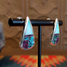 Sterling silver triangular earrings with multistone inlay set in the bezel.