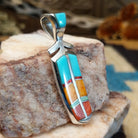 Sterling silver feather pendant with multistone inlay.