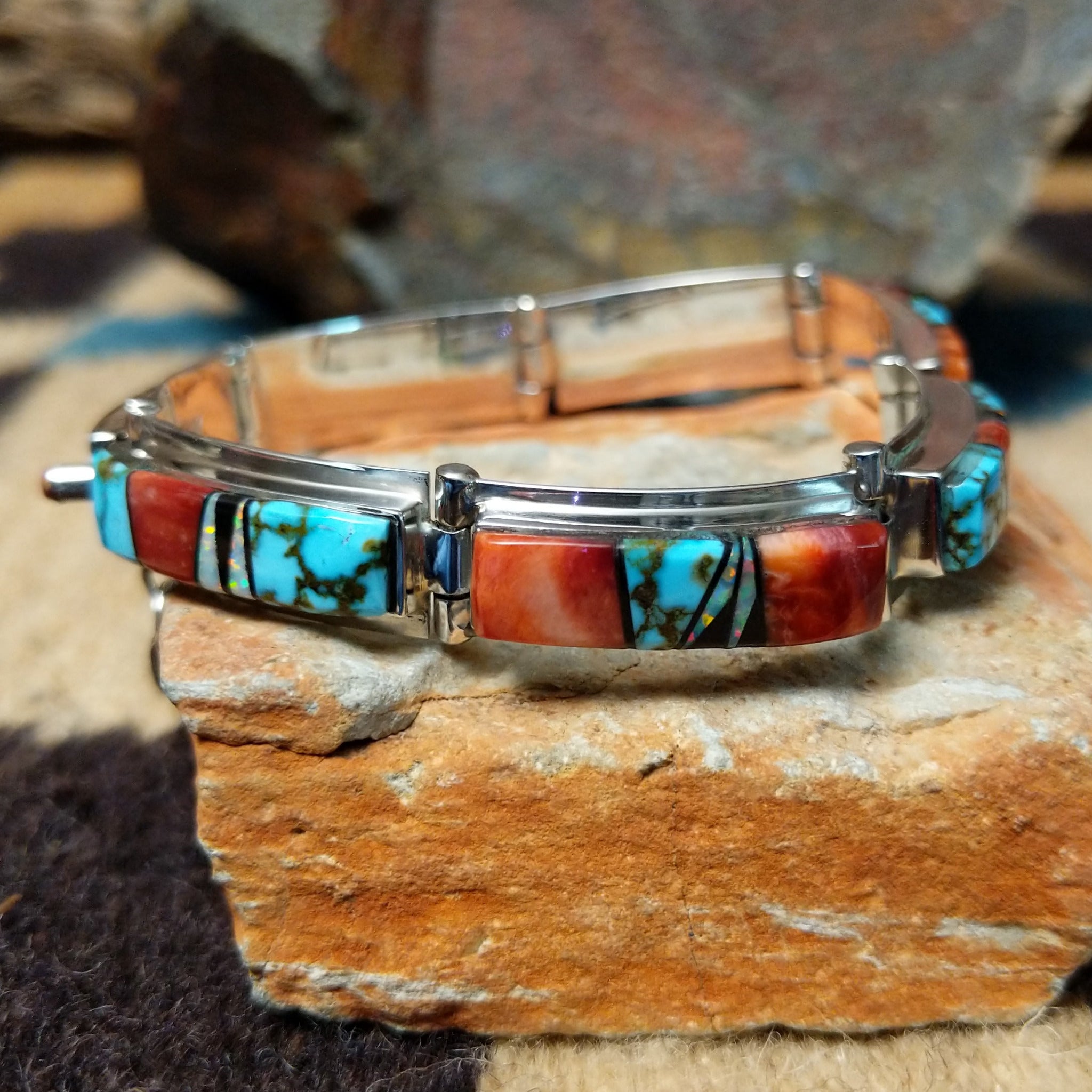 Sterling silver multistone inlay link bracelet by Cooper Willie with colorful Southwestern stone inlay.