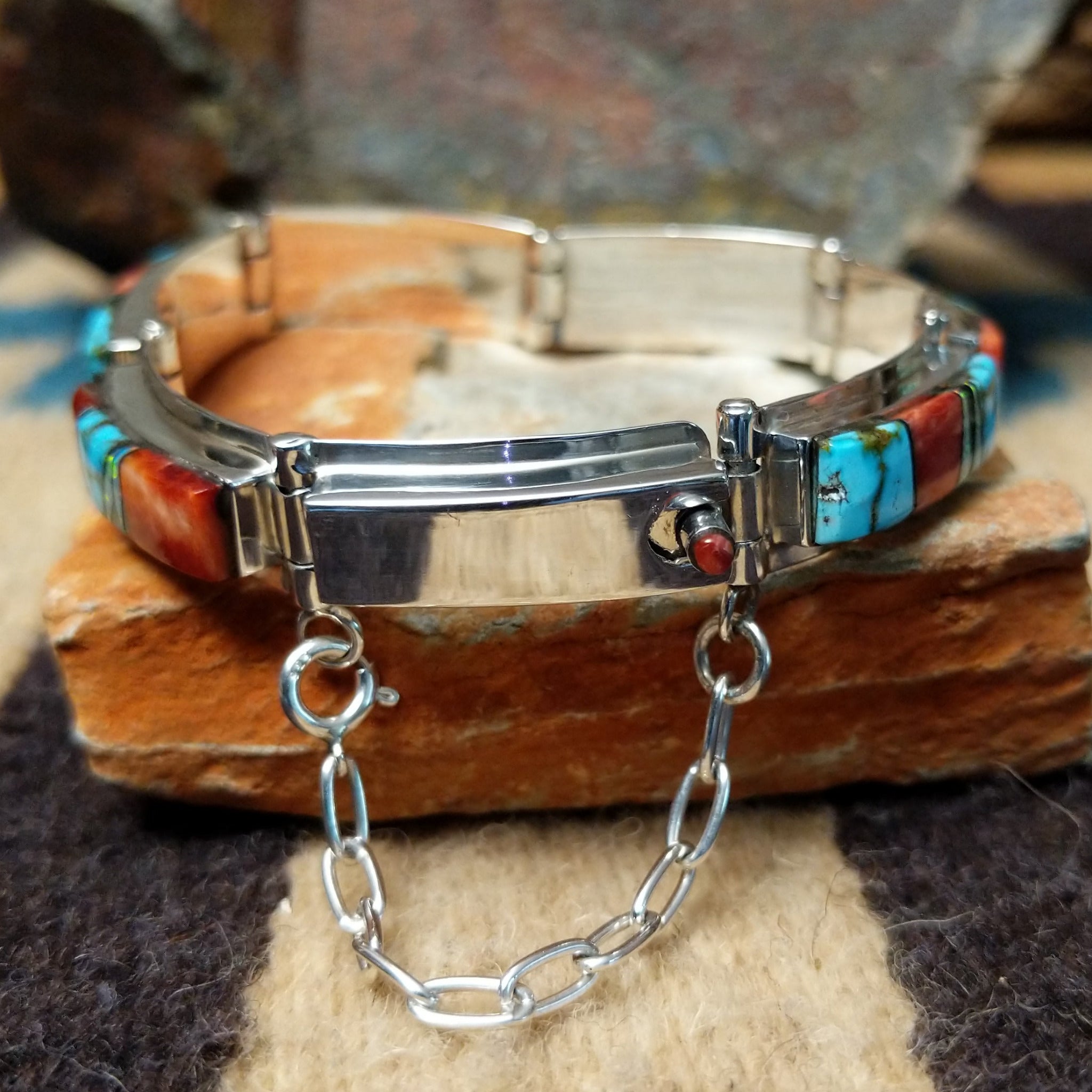 Sterling silver multistone inlay link bracelet by Cooper Willie with colorful Southwestern stone inlay; underside and clasp view with safety chain.
