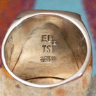 Multistone Inlay Ring by E.D. featuring a large rectangular face with geometric turquoise, blue, purple, cream, and multicolored stone inlay separated by fine silver channels; artisan and Sterling Silver stamp.
