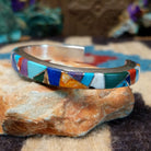 Multistone Medley cuff by Elsie Yellowhorse, featuring a colorful arrangement of natural stones set in handcrafted Southwestern-inspired metalwork.