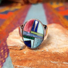 Multistone Oval Inlay Ring by E.D. featuring a geometric mosaic of stones separated by fine silver channels in a polished silver setting.