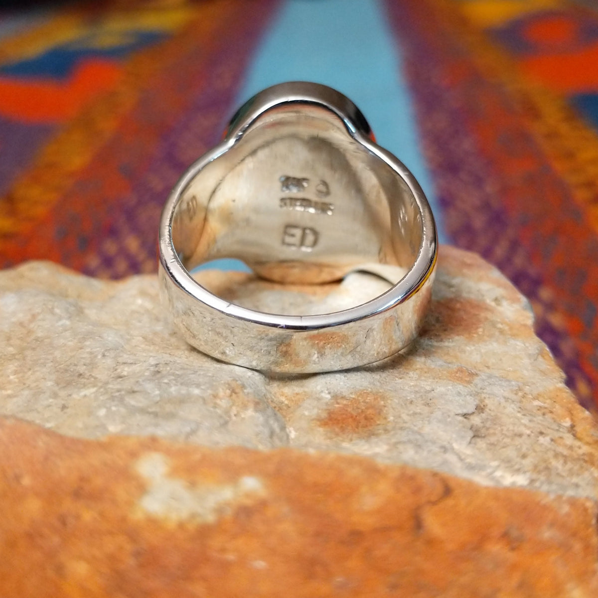Multistone Oval Inlay Ring by E.D. featuring a geometric mosaic of stones separated by fine silver channels in a polished silver setting; underside view.