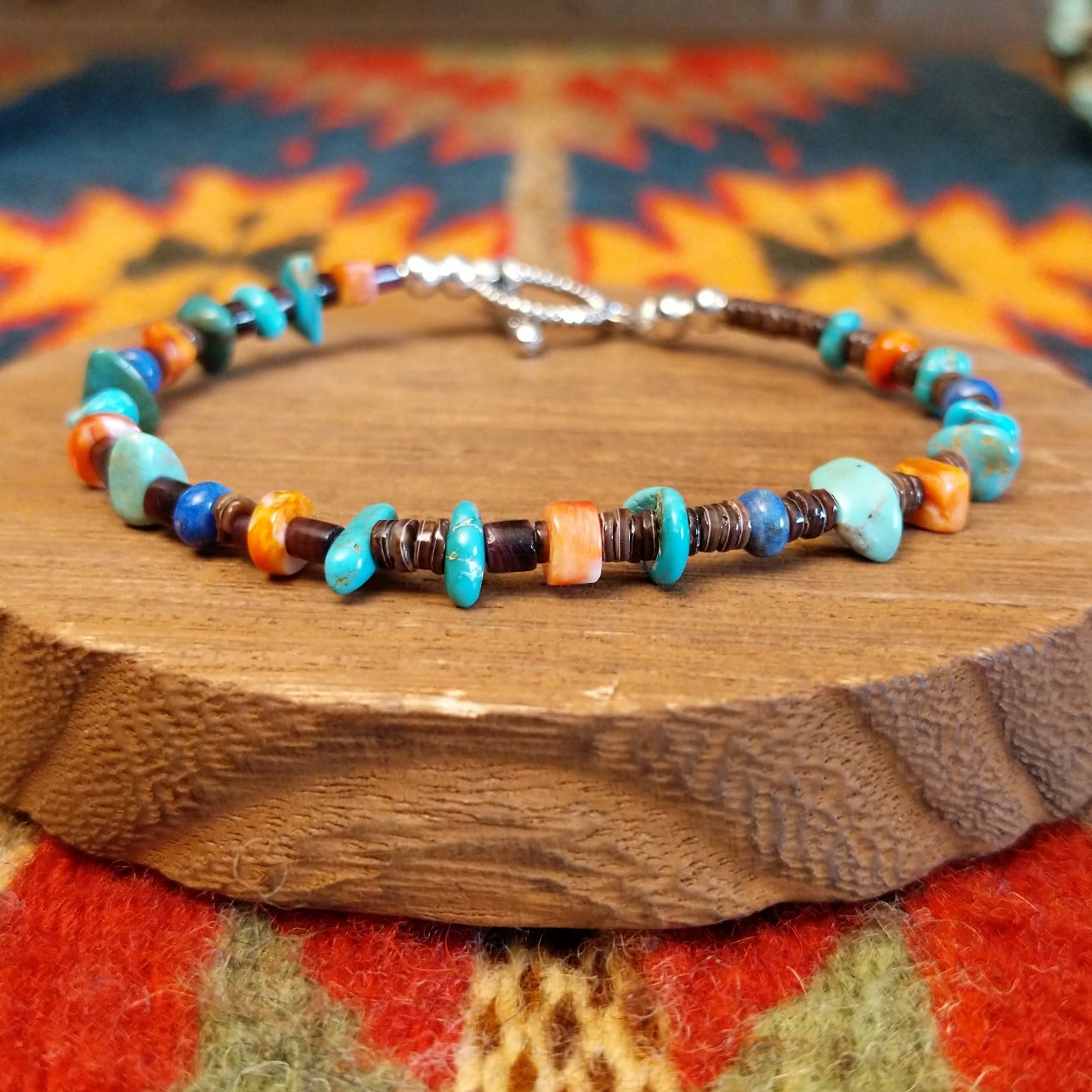 Sterling silver bracelet with beaded turquoise, orange spiny oyster shell, and pen shell.