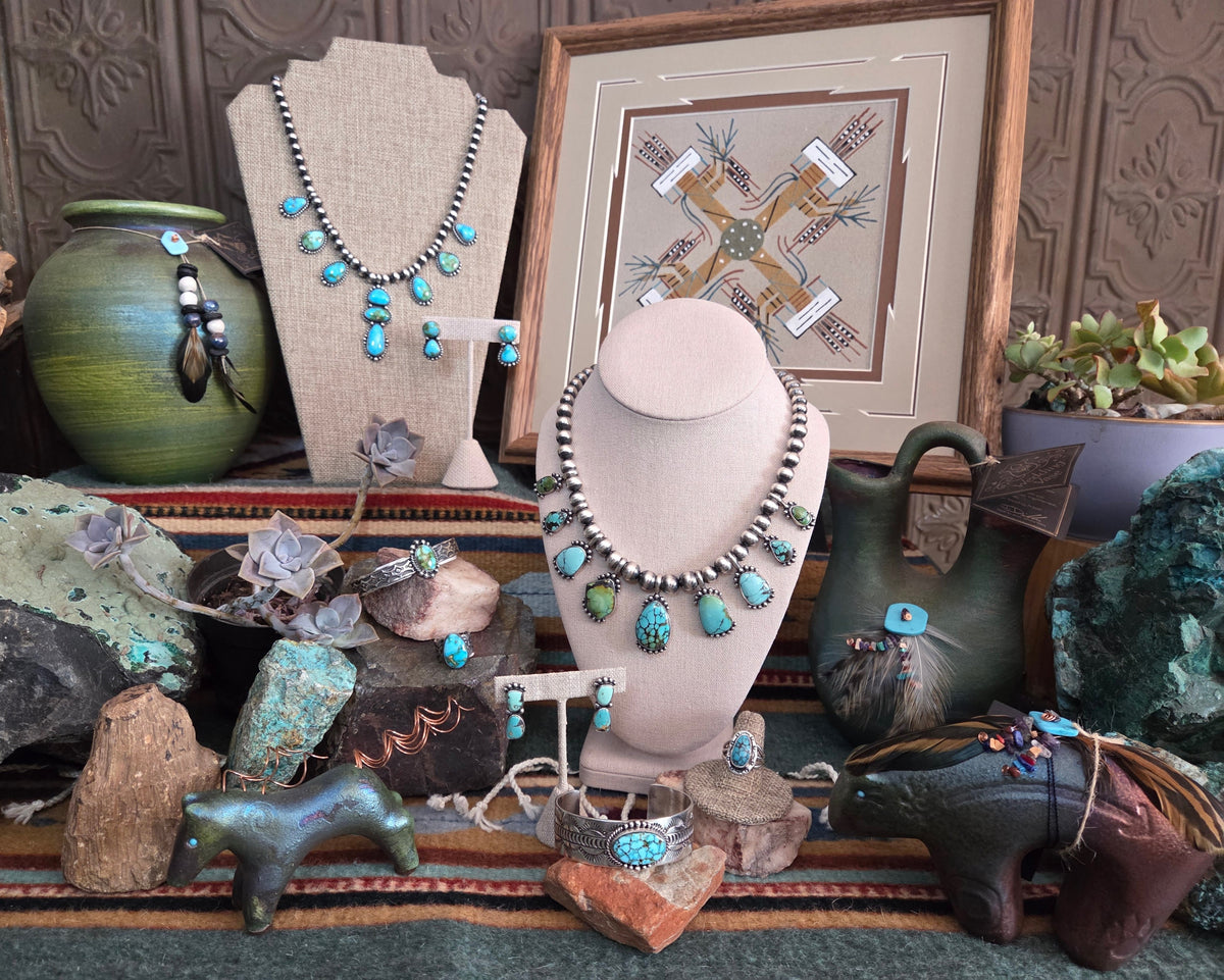 collection of Native American turquoise and slterling silver jewlry sets with raku pottery pieces & sand paintings