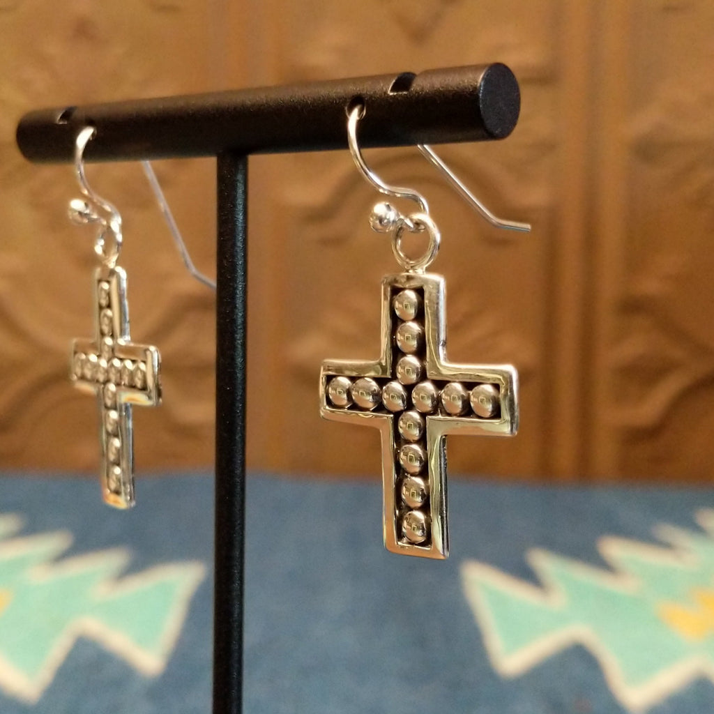 Sterling silver cross earrings with beaded accents on the interior bezels.