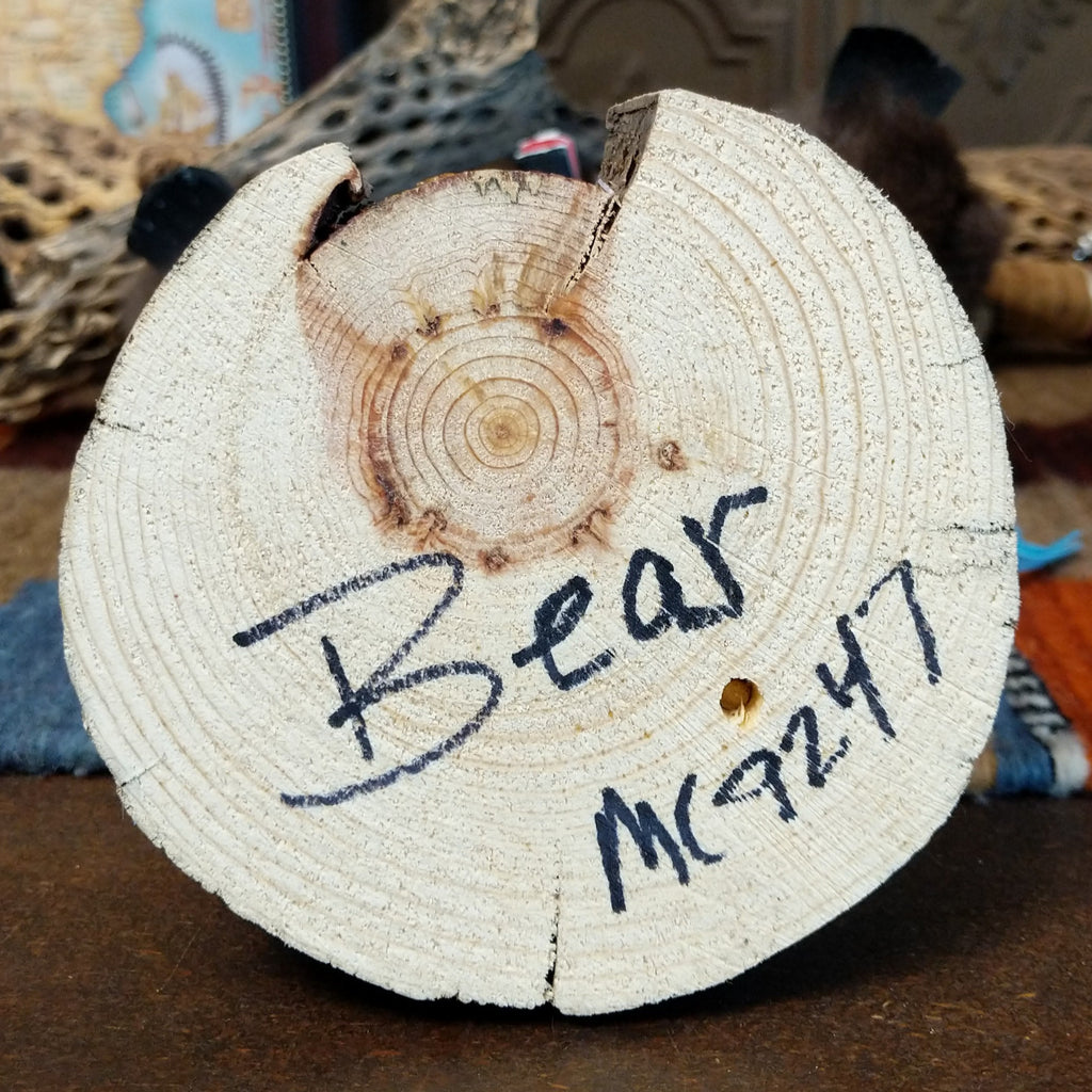 The base features the title and artisan's initials.