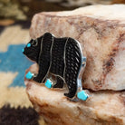 Sterling silver bear pendant with black onyx and turquoise set in the bezel.