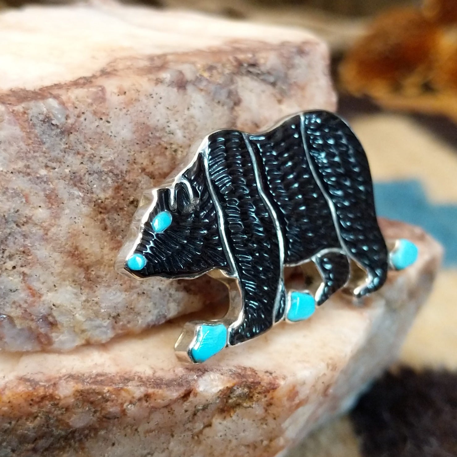 Sterling silver bear pendant with black onyx and turquoise set in the bezel.