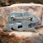 Close-up of the artisan's stamped signature.