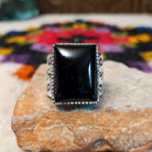 Navajo black onyx ring by J.P.J. with stamped silver band.
