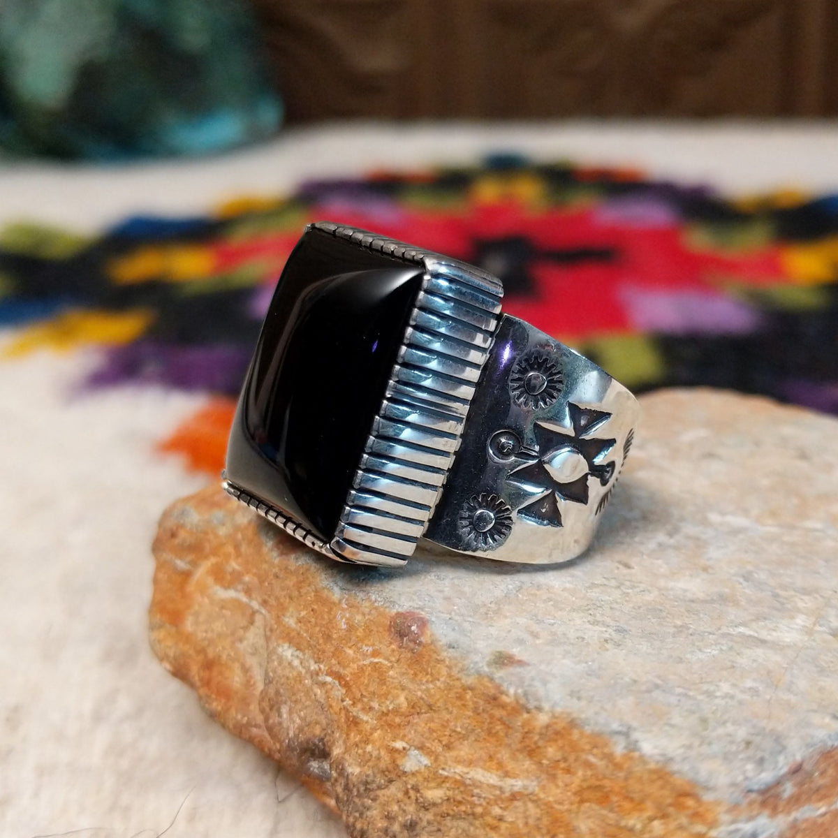 Navajo black onyx ring by J.P.J. with stamped silver band.