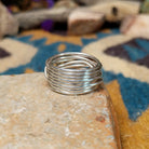 Navajo sterling silver multi-strand ring with polished Black Onyx cabochons; underside view.