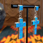 Sterling silver earrings with blue manmade opal inlaid in the cross settings.